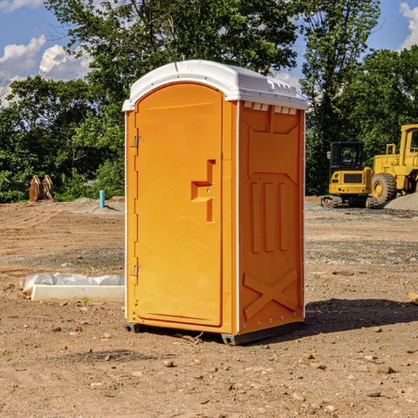 what is the cost difference between standard and deluxe portable restroom rentals in Ashton